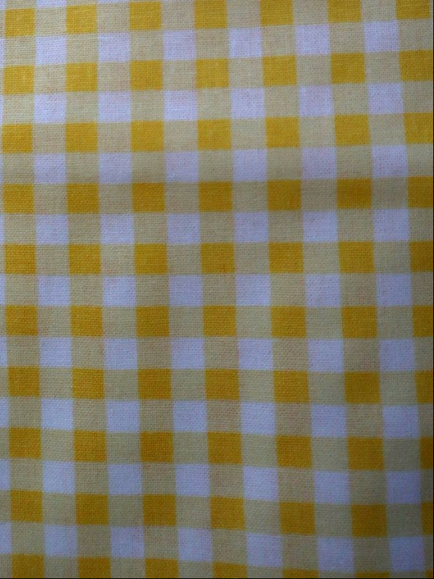 Yellow and white checkered fabric pattern