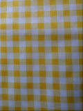 Yellow and white checkered fabric pattern